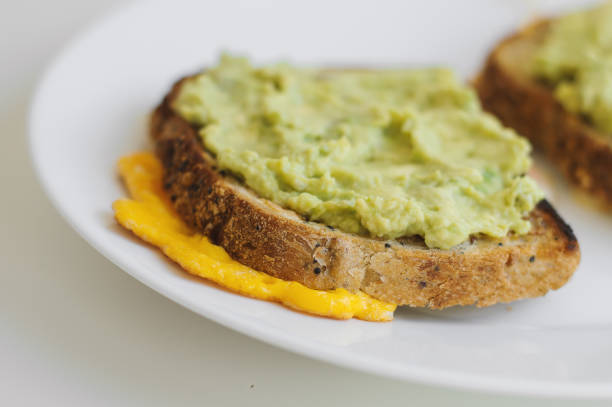 istock Healthy toast with whole grain quinoa bread, avocado and egg. Breakfast meal. Sandwich 1007749670