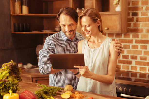 istock Loving couple looking at their gadget 1007753398