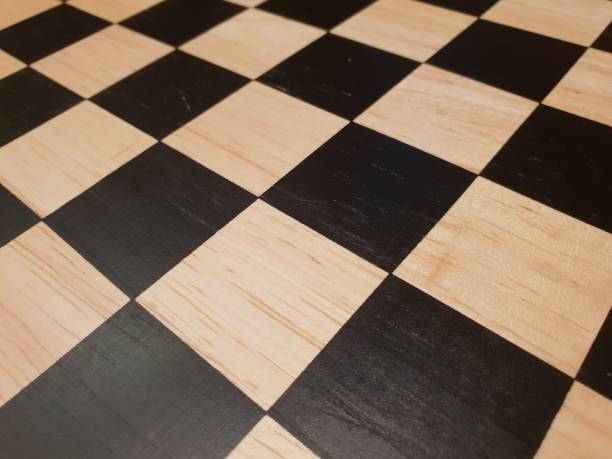 istock How to play wooden board game chess. Improvisation and Different angles of chess sets, pieces and chessboard. White and black figures and board of chess game. 1007753404