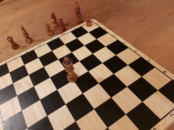 istock How to play wooden board game chess. Improvisation and Different angles of chess sets, pieces and chessboard. White and black figures and board of chess game. 1007753490
