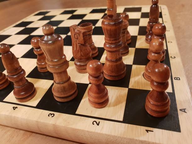 istock How to play wooden board game chess. Improvisation and Different angles of chess sets, pieces and chessboard. White and black figures and board of chess game. 1007753576