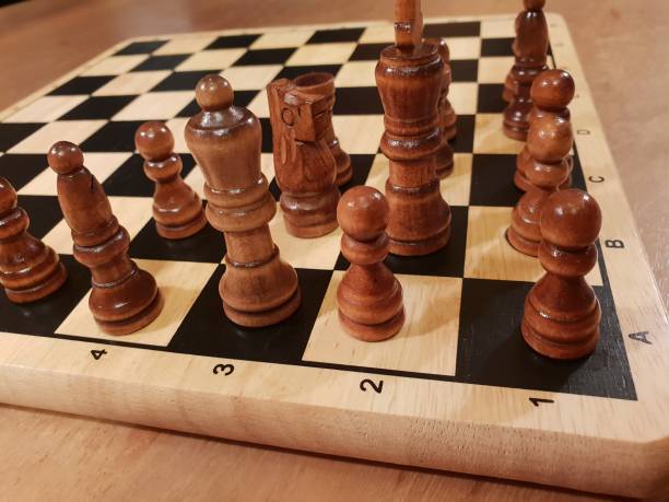 istock How to play wooden board game chess. Improvisation and Different angles of chess sets, pieces and chessboard. White and black figures and board of chess game. 1007753580