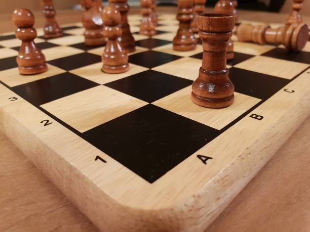 istock How to play wooden board game chess. Improvisation and Different angles of chess sets, pieces and chessboard. White and black figures and board of chess game. 1007753612