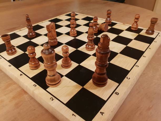 istock How to play wooden board game chess. Improvisation and Different angles of chess sets, pieces and chessboard. White and black figures and board of chess game. 1007753636