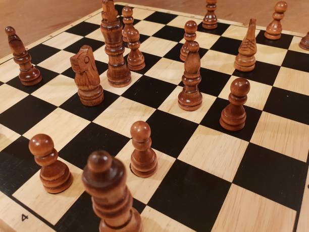 istock How to play wooden board game chess. Improvisation and Different angles of chess sets, pieces and chessboard. White and black figures and board of chess game. 1007753668