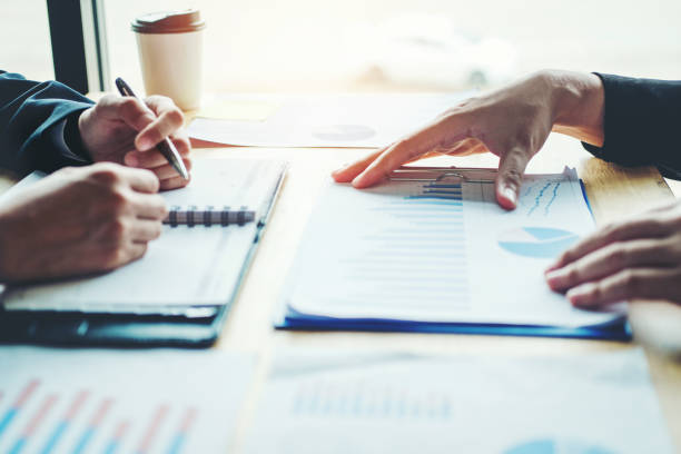 istock Business team colleagues meeting Planning Strategy Analysis discussing new plan financial on graph data new business project 1007757242