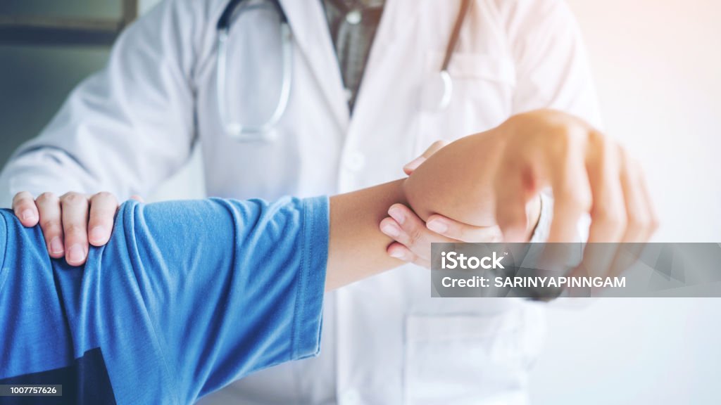 Doctor consulting with patient Shoulder problems Physical therapy diagnosing concept Doctor Stock Photo