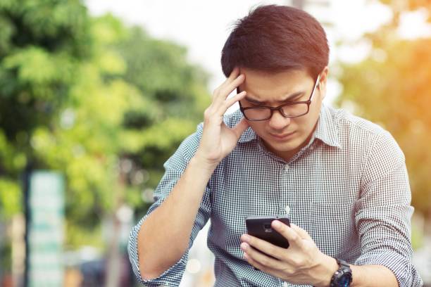 istock Handsome Business man in an using telephone Notifications bad news. 1007758032