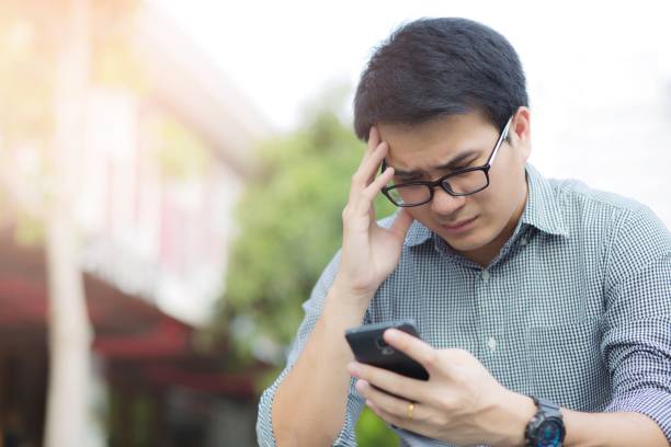 istock Handsome Business man in an using telephone Notifications bad news. 1007758034