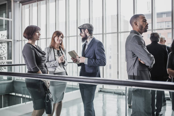 istock Business People Discussing in The Hallway 1007758168