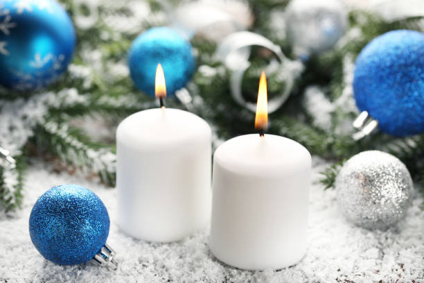 istock Christmas candles with fir-tree branches and baubles 1007759732