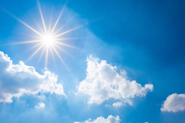 Blue sky with bright sun and clouds Sunny background, blue sky with white clouds and sun air blue climate nobody stock pictures, royalty-free photos & images