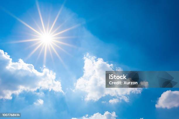 Blue Sky With Bright Sun And Clouds Stock Photo - Download Image Now - Sunny, Sun, Sky