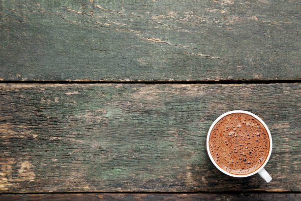 istock Cup of coffee on grey wooden table 1007768448