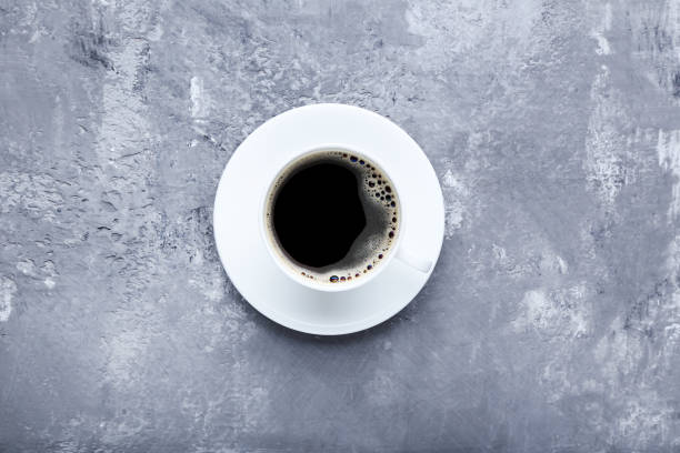 istock Cup of coffee on grey wooden table 1007769050
