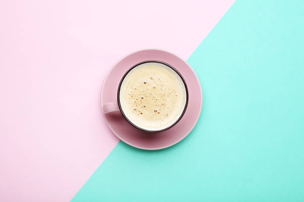 istock Cup of coffee on colorful background 1007776354