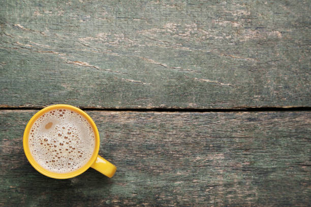 istock Cup of coffee on grey wooden table 1007776694