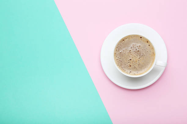 istock Cup of coffee on colorful background 1007776960