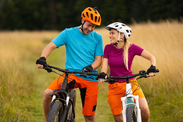 istock young couple with electric mountain bikes in grassland 1007782264