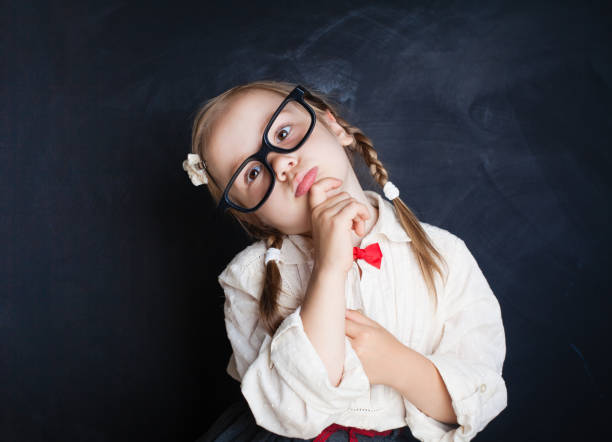 istock Smart school kid in glasses thinking. Back to school, Kid Creativity and Education Concept 1007786674