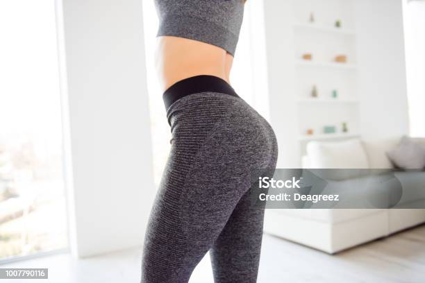 Weightloss Wellness Eating Nutrition Vitality Concept Cropped Close Up View Photo Of Sexual Sporty Sportive Tempting Beautiful Attractive Nice Round Ass Wearing Gray Tight Pants Leggings Stock Photo - Download Image Now