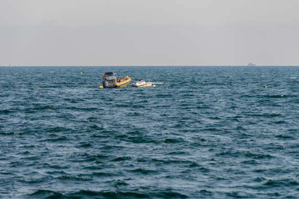 istock seascape with a motor boat on the horizon 1007790732