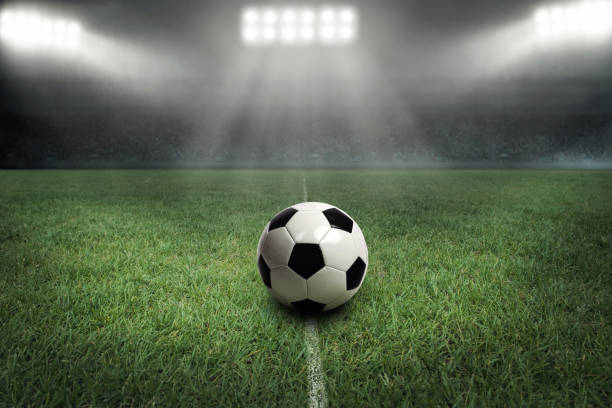 istock Foot ball in a stadium with flood light 1007790862