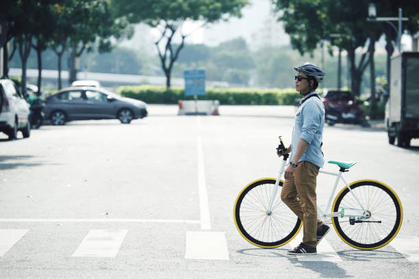 istock Cycylist crossing road 1007793804