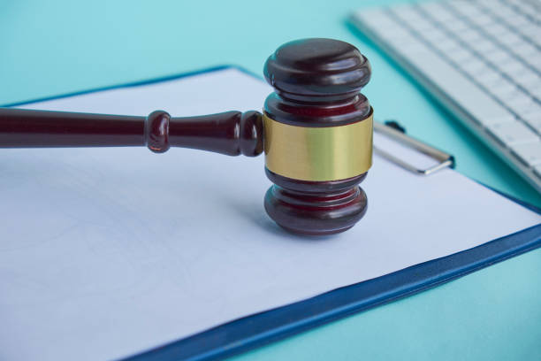 istock Wooden gavel and keyboard on desk 1007793984