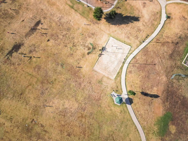 istock Top view urban park with curved pathway and volleyball, basketball fields 1007797872