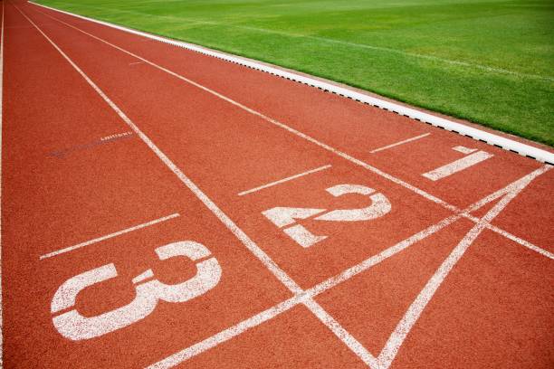 istock Athlete Track or Running Track with three numbers lanes and lawn 1007798542