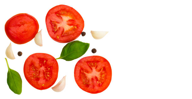 istock tomato, garlic and basil isolated on white background, top view 1007799140