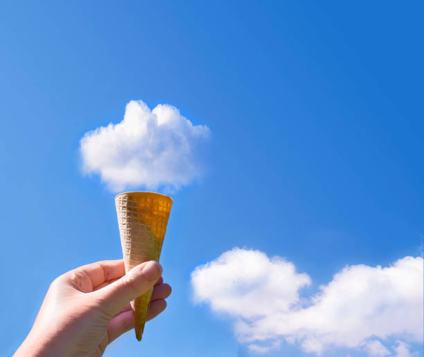Cloud Ice Cream Cone Creative picture of woman holding ice cream cone in the sky with fluffy cloud on the top of cone ice cream cone photos stock pictures, royalty-free photos & images