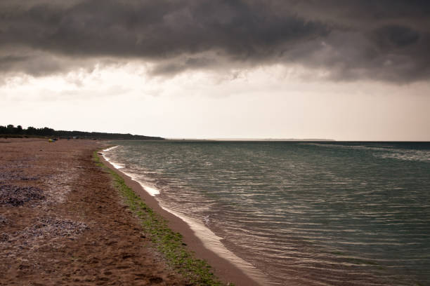 Dynamic weather over a coastal zone, in the evening hours of a summer day.
