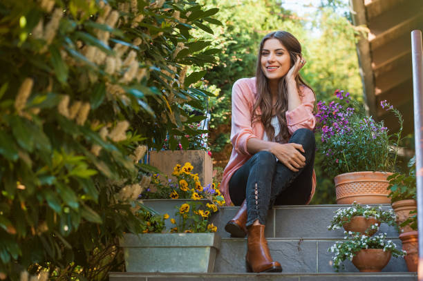 istock Relaxed young female smiling on home terrace. 1007810714