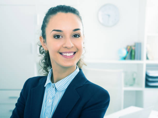 istock Successful laughing woman working in office 1007811024