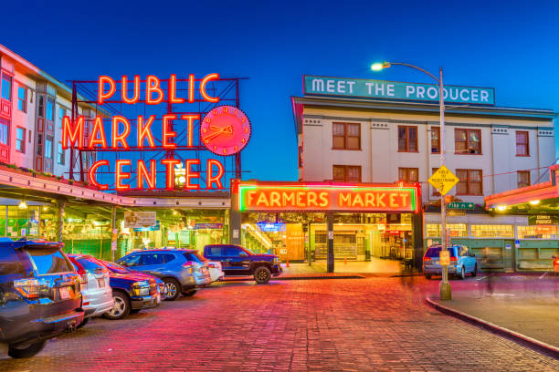 Pike Place Market Seattle Seattle, Washington - July 2; 2018: Pike Place Market at night. The popular tourist destination opened in 1907 and is one of the oldest continuously operated public markets in the United states. fish market photos stock pictures, royalty-free photos & images