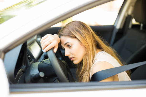 istock Tired woman stuck in traffic jam 1007814532