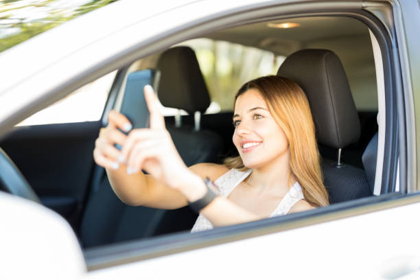 istock Woman taking selfie in her new car 1007815046