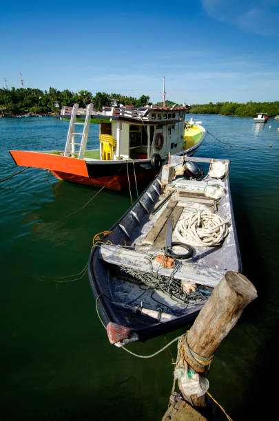 istock traditional fisherman boat moored under bright sunny day 1007824508