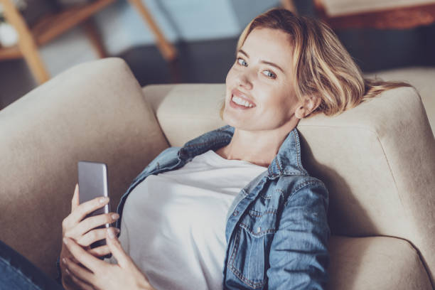 istock Delighted young woman looking at camera 1007833192