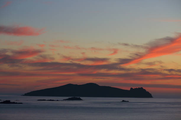 Sunset over Inishtooskirt Island known locally as The Sleeping Bishop is the northern most of the Blasket Islands part of Irelands wild Atlantic Way