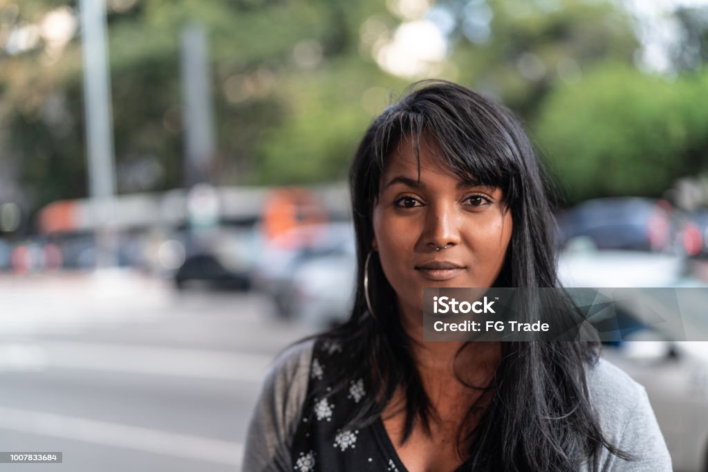 Portrait of a Young Woman in the city Real People Serious Stock Photo