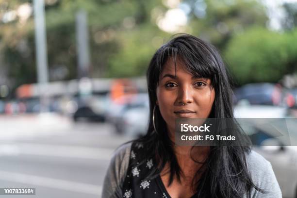 Portrait Of A Young Woman In The City Stock Photo - Download Image Now - Serious, Women, Portrait