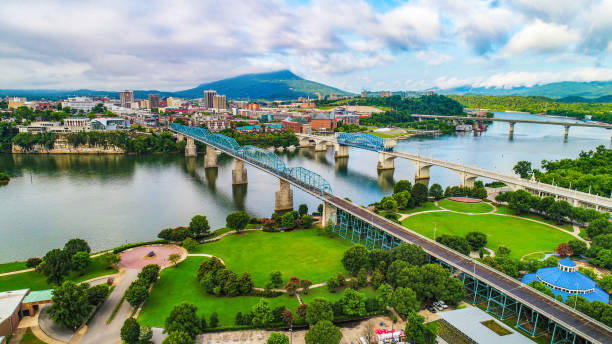 Drone Aerial of Downtown Chattanooga Tennessee Skyline Drone Aerial of Downtown Chattanooga TN Skyline, Coolidge Park and Market Street Bridge. tennessee stock pictures, royalty-free photos & images