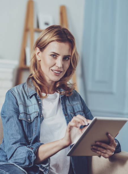istock Positive delighted woman posing on camera 1007836214