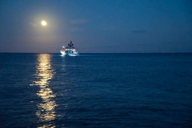 istock Italy Sicily, Aeolian Islands, Panarea full moon reflected on the sea 1007839582