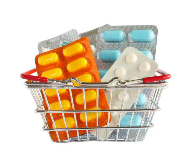 Medicine pills package in shopping basket isolated on white background