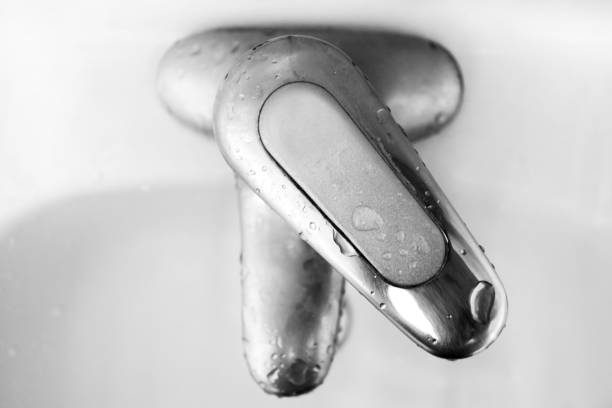istock Faucet with water in the bathroom.Water drop. Slow Motion 120 fps. 1007840958