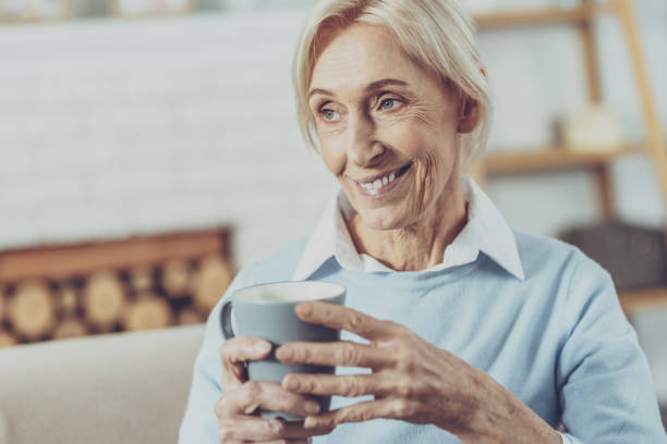 istock Amazing mature female drinking favorite tea 1007844636